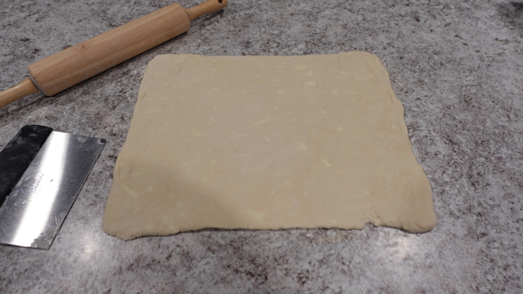 Biscuit dough rolled out with butter