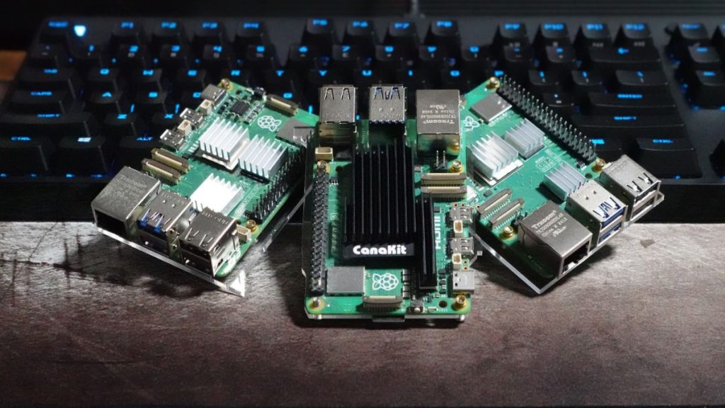 Three Raspberry Pi 5 boards ready to be turned into web servers